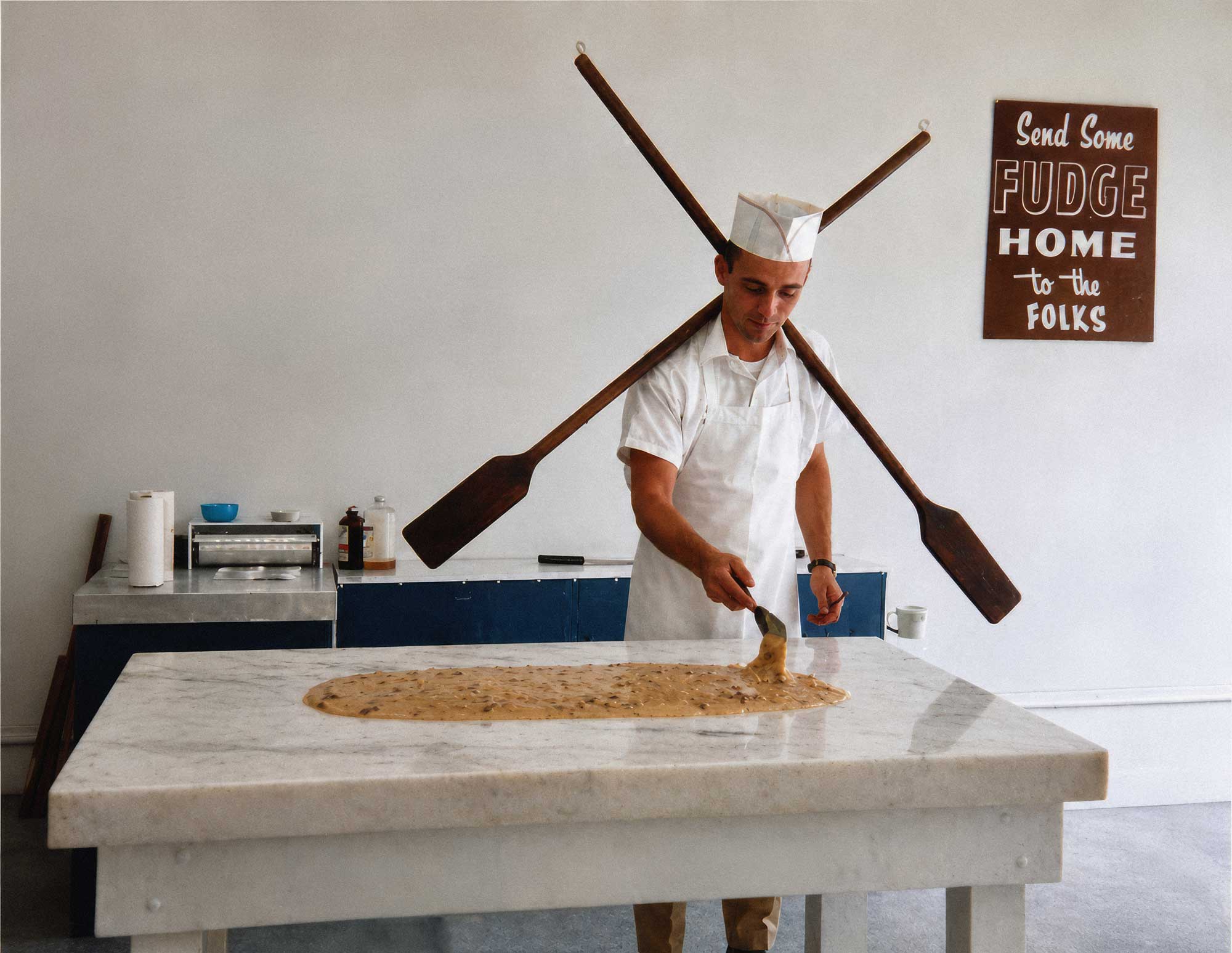 Gary McClellan making an early batch of fudge on a marble table